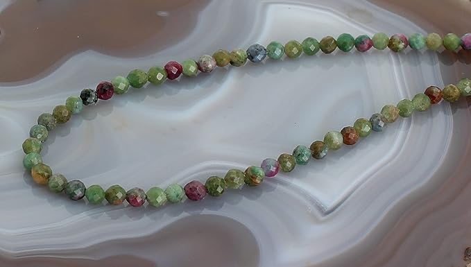 rubin zoisit Stein Trommelstein Hals Schmuck Anhänger Edelstein Heilstein Rohstein Rohstück Glücksstein Schutzstein Lochstein Naturstein Amulett Deko Handstein Handschmeichler Kugel Ohrringe Ohrstecker Armband