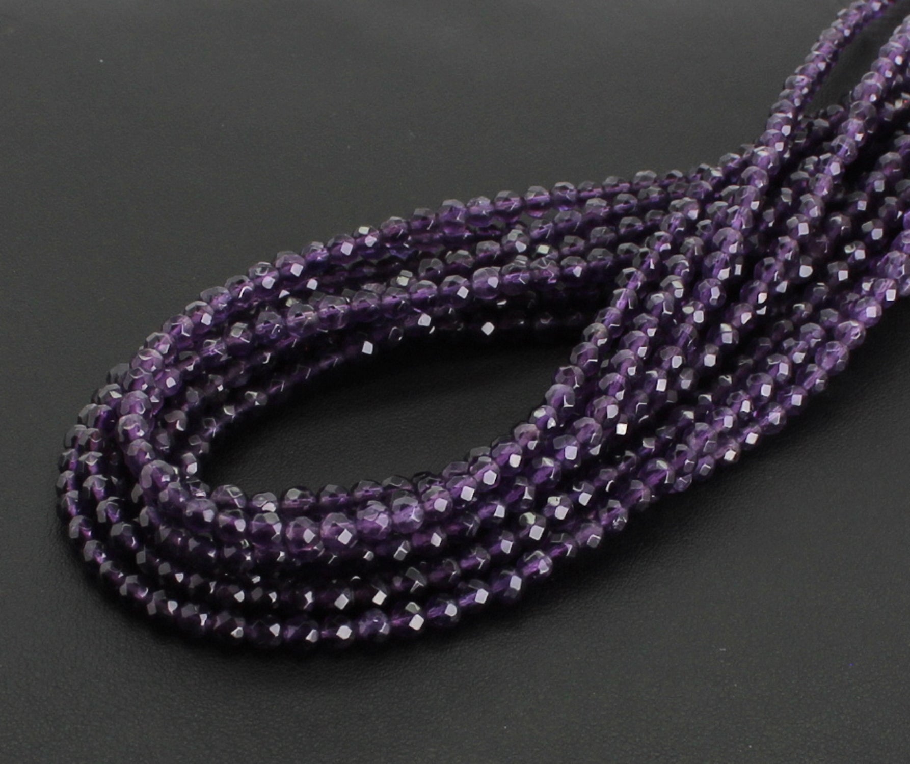 Stein Trommelstein Kugelkette Buttonkette Collier Halsschmuck Kettenschmuck Edelstein Heilstein Edelsteinkette Heilsteinkette Schmuck Rohstein Rohstück Schutzstein Glücksstein Amethyststein Amethystschmuck