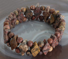 Leopardenjaspis Stein Trommelstein Anhänger Perlenarmband Kugelarmband Edelsteinarmband Edelstein Heilstein Schmuck Schmuckstein Kette Kettenanhänger Perlen Kugel Gummiarmband Stretcharmband Armschmuck Jaspisstein Jaspisschmuck
